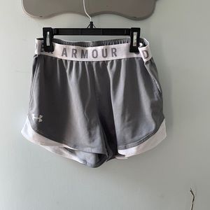 Gray and whit under armor workout shorts